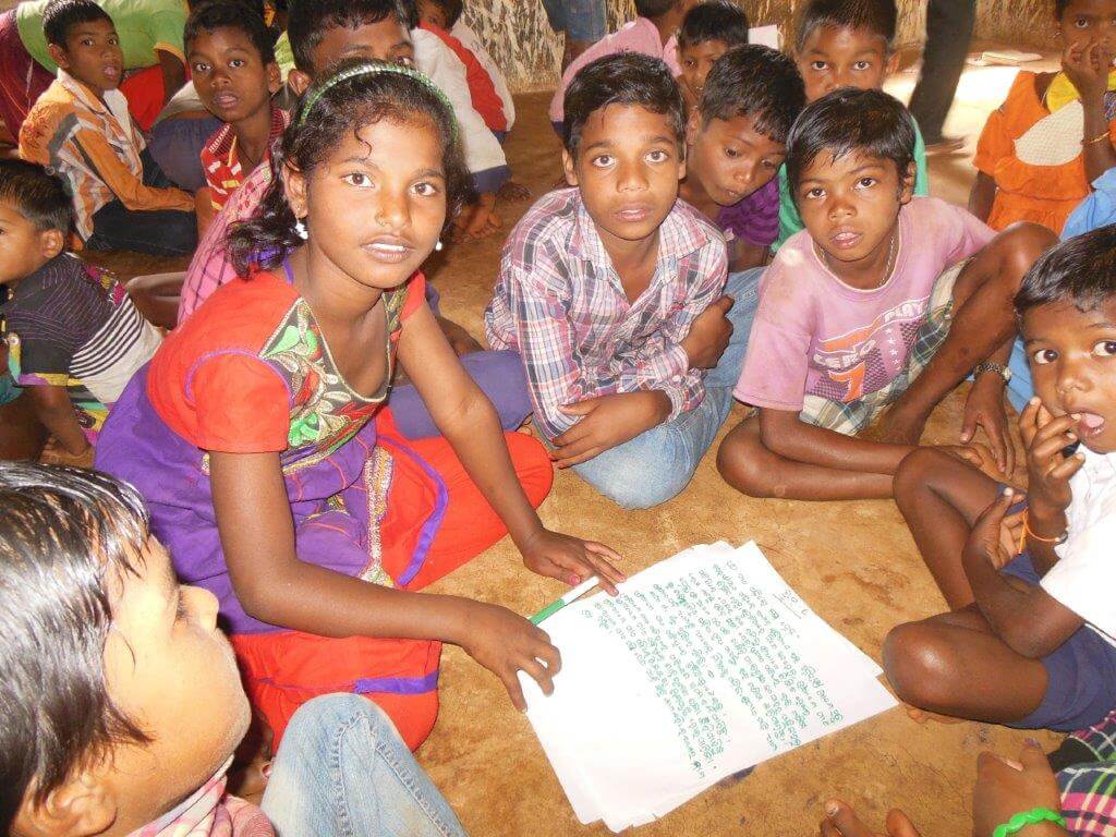 Children supporting each with other with school work and education