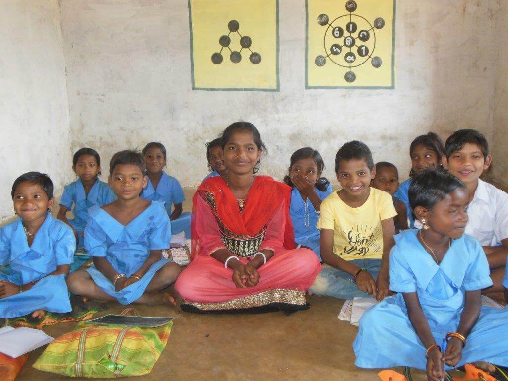 Sunita in her class with her classmates